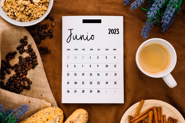 Flat lay 2023 june calendar with snacks