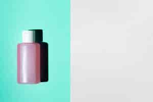 Free photo flat lay of acetone bottle with copy space