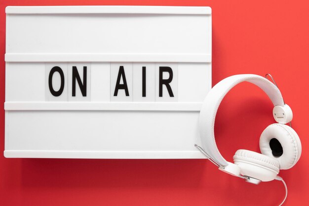 Flat lay on air sign with red background