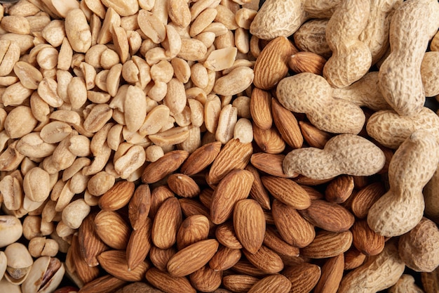 Flat lay of almonds with peanuts