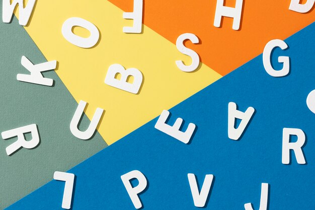 Flat lay of alphabet letters for education day