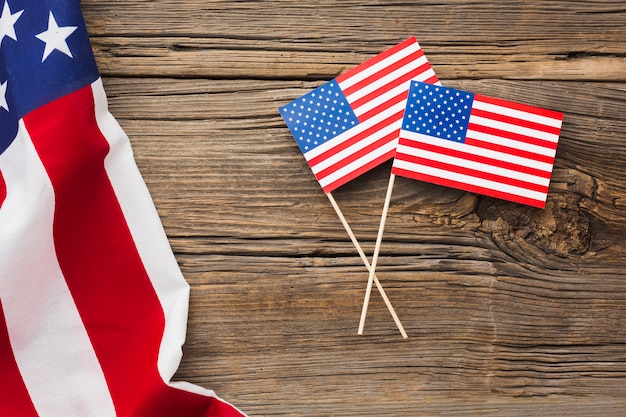 Flat lay of american flags on wood