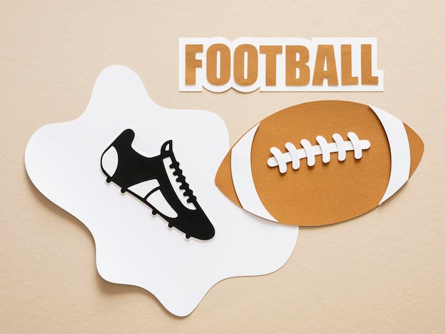 Flat lay of american football and sneaker