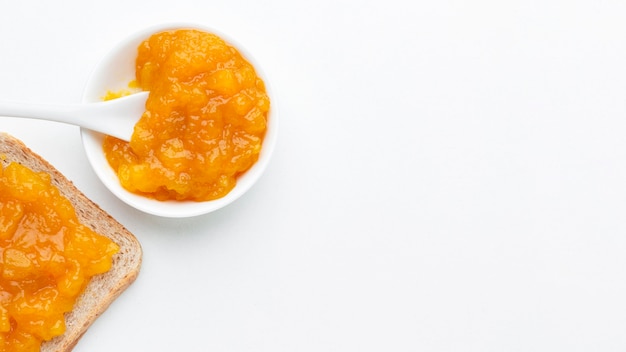 Flat lay apricots jam on bread
