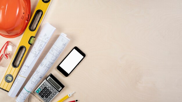 Flat lay of architect desk with phone