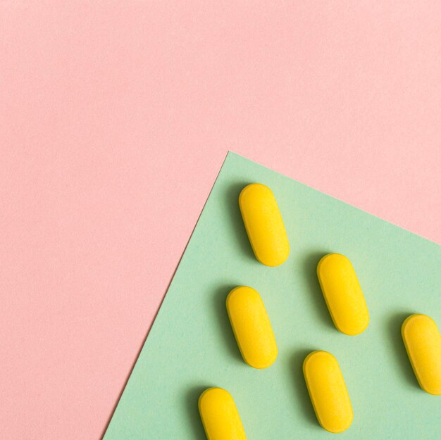 Flat lay of arranged pills with copy space