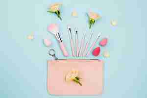 Free photo flat lay arrangement of beauty products on blue background