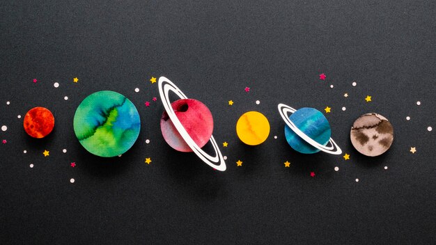 Flat lay arrangement of creative paper planets