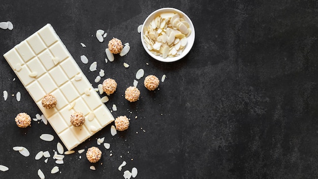 Flat lay arrangement of delicious chocolate products with copy space