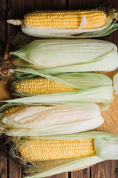 Free photo flat lay arrangement of delicious corns