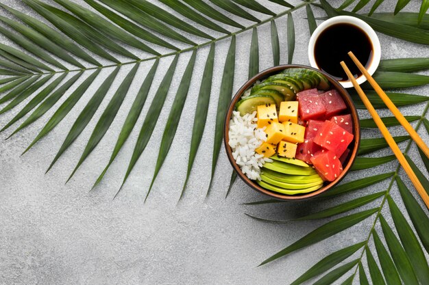 Flat lay arrangement of delicious poke bowl