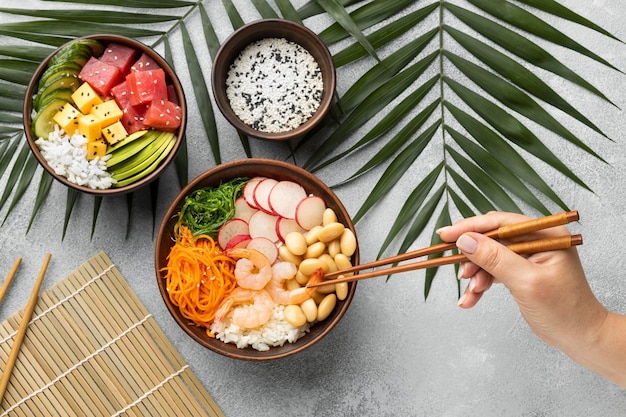 Flat lay arrangement of delicious poke bowl