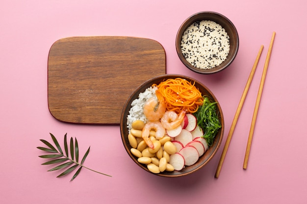 Flat lay arrangement of delicious poke bowl