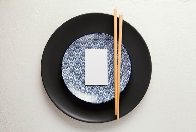 Flat lay arrangement of elegant tableware with smartphone