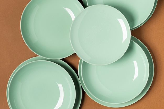 Flat lay arrangement of green plates