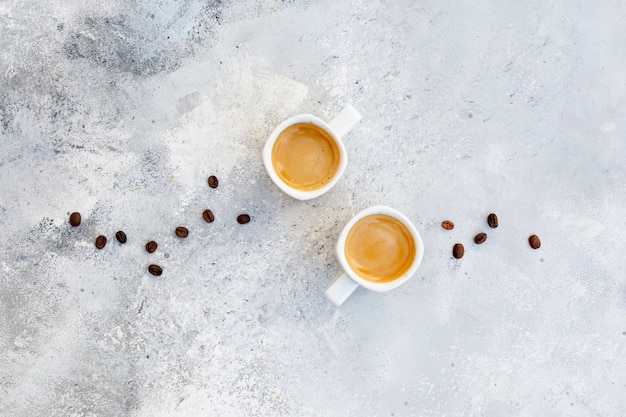 Free photo flat lay arrangement with cappuccino on stucco background