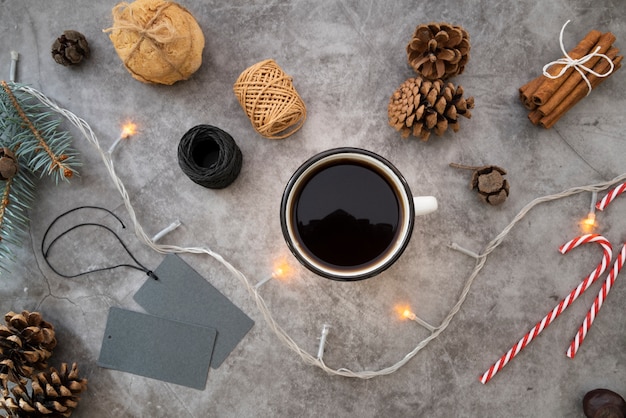 Flat lay arrangement with coffee cup on stucco background