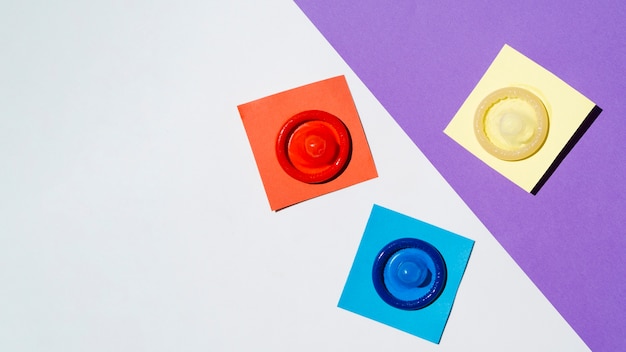 Free photo flat lay arrangement with colourful condoms