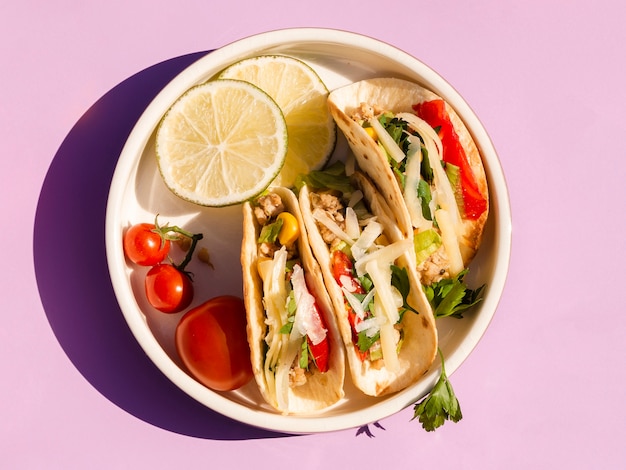 Free photo flat lay arrangement with delicious food on purple background