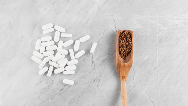 Flat lay arrangement with medication and spoon