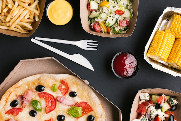 Flat lay arrangement with pizza and corn