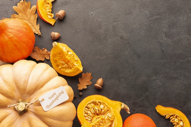 Flat lay arrangement with pumpkins on stucco background