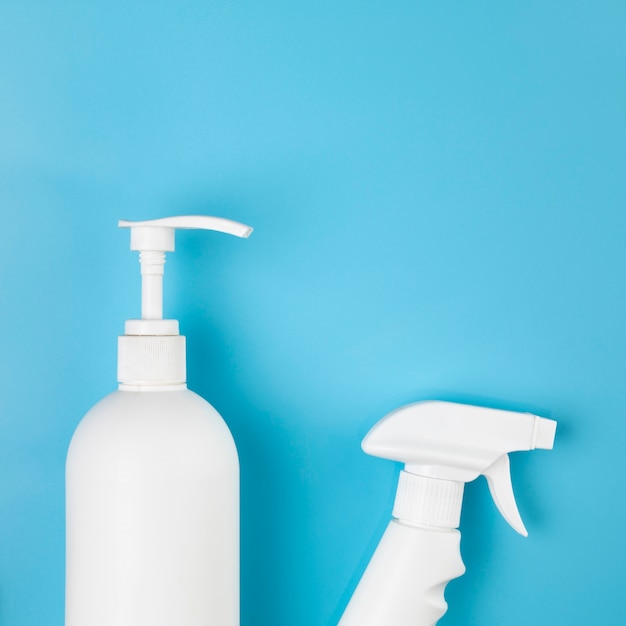 Flat lay arrangement with spray and soap bottles 