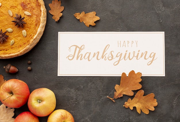 Free photo flat lay arrangement with thanksgiving sign and food