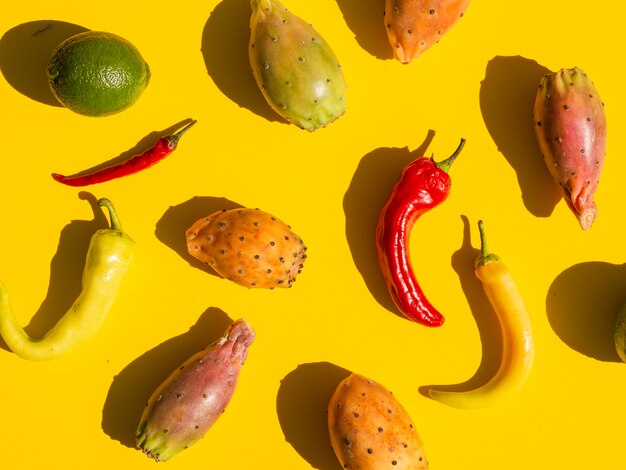 Flat lay arrangement with vegetables and yellow background