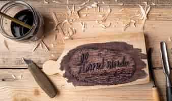 Free photo flat lay artisan jobs equipment and hand made words on wood