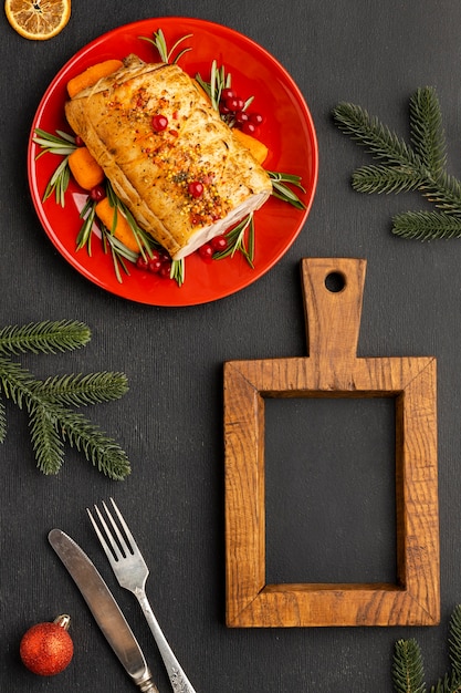 Flat lay assortment of christmas food with empty blackboard