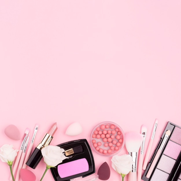 Flat lay assortment of cosmetics with copy space