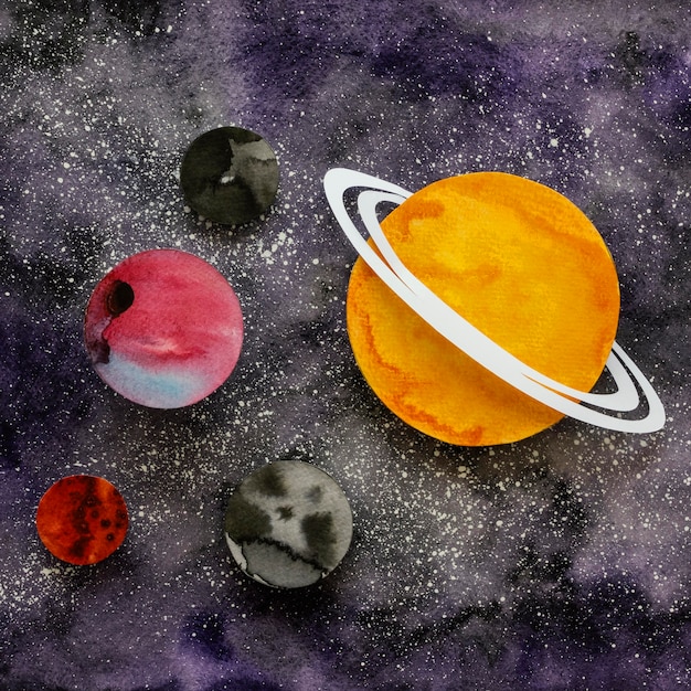 Flat lay assortment of creative paper planets