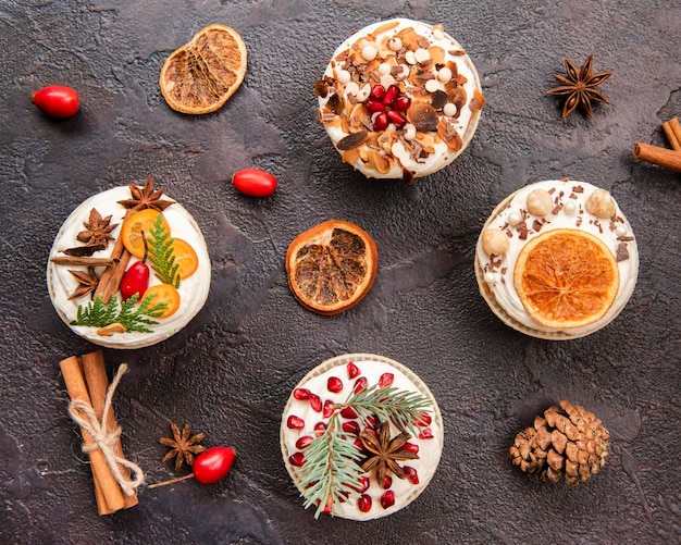 Flat lay of assortment of cupcakes with icing and decoration