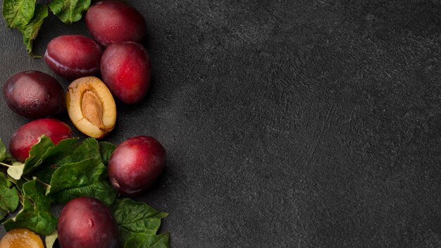 Flat lay assortment of delicious fruits with copy space