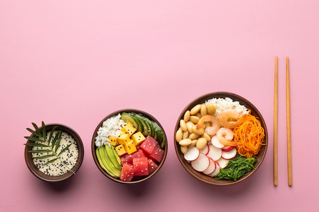 Flat lay assortment of delicious poke bowl