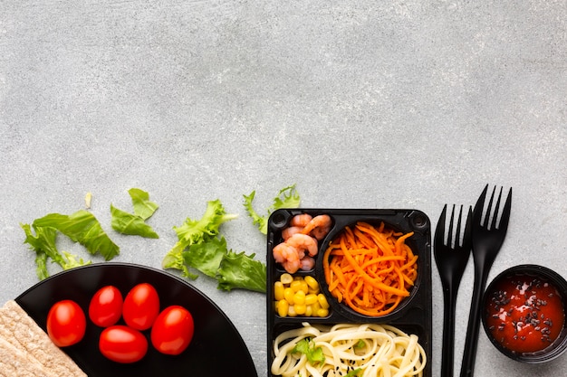 Flat lay assortment of different foods with copy space