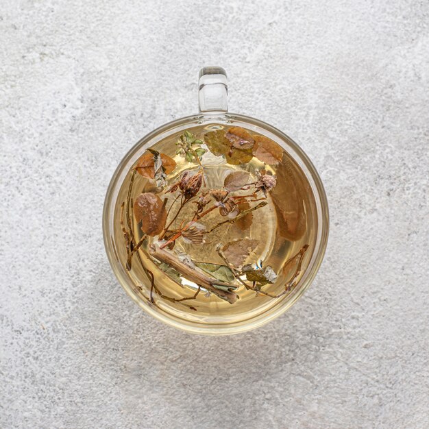 Flat lay assortment of dried plants in tea