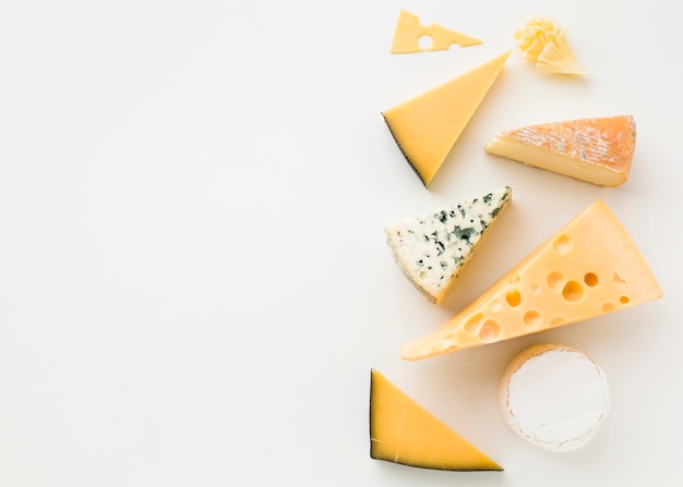 Flat lay assortment of gourmet cheese with copy space