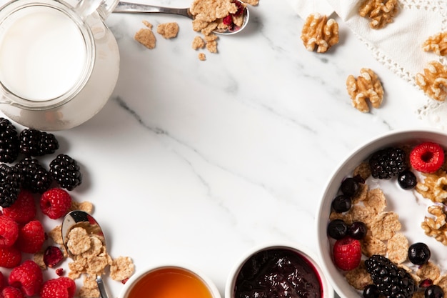 Flat lay assortment of healthy bowl cereals with copy space