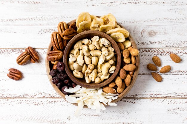 Flat lay of assortment of nuts in bowls