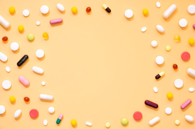 Free photo flat lay of assortment of pills with copy space