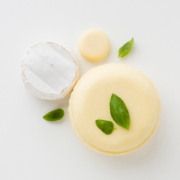 Flat lay assortment of round cheese