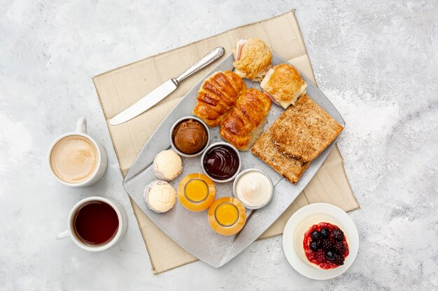 Flat lay assortment with delicious breakfast and cappuccino