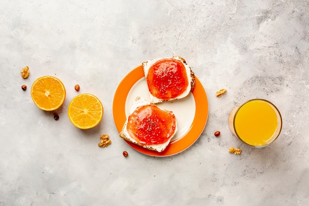 Flat lay assortment with jelly and juice on stucco background