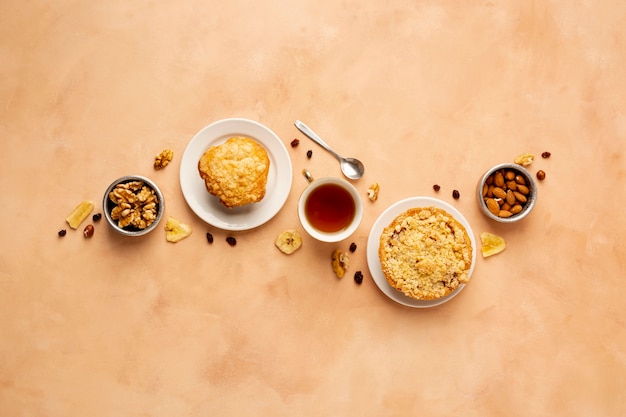 Flat lay assortment with muffins and tea