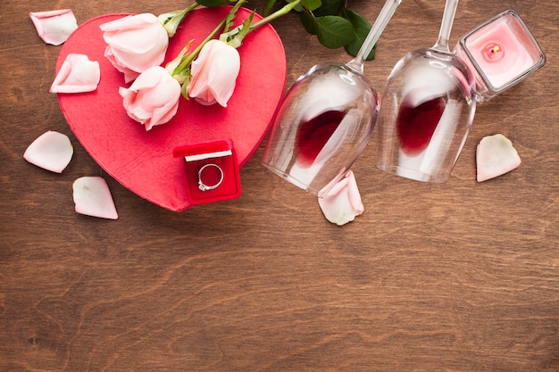 Flat lay assortment with pink rose petals