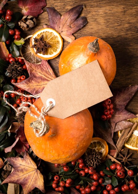 Flat lay of autumn elements arrangement with tag