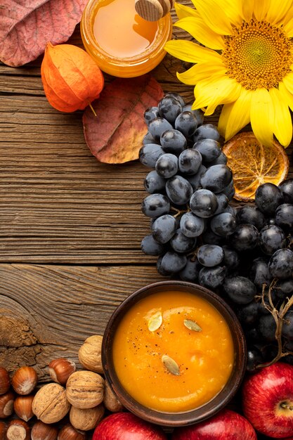 Flat lay autumn fruit and pumpkin soup