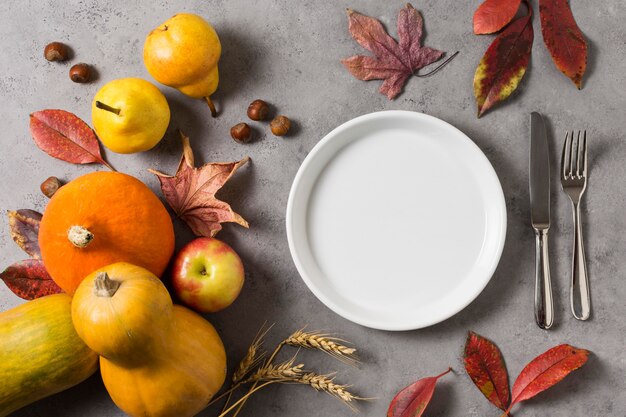 Flat lay autumn harvest with plate